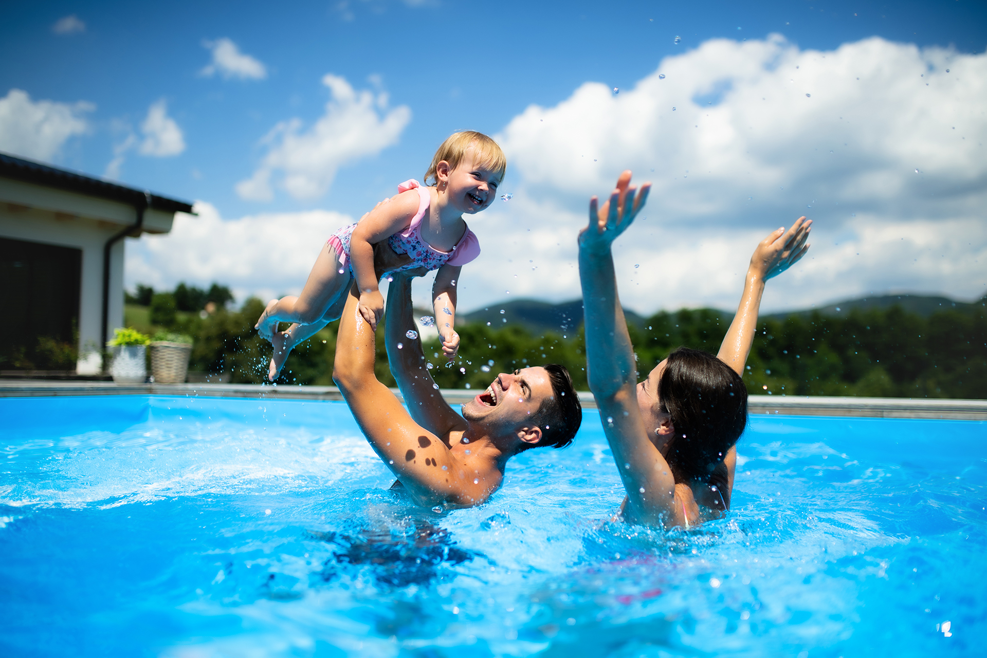 Family Playing In Pool Child